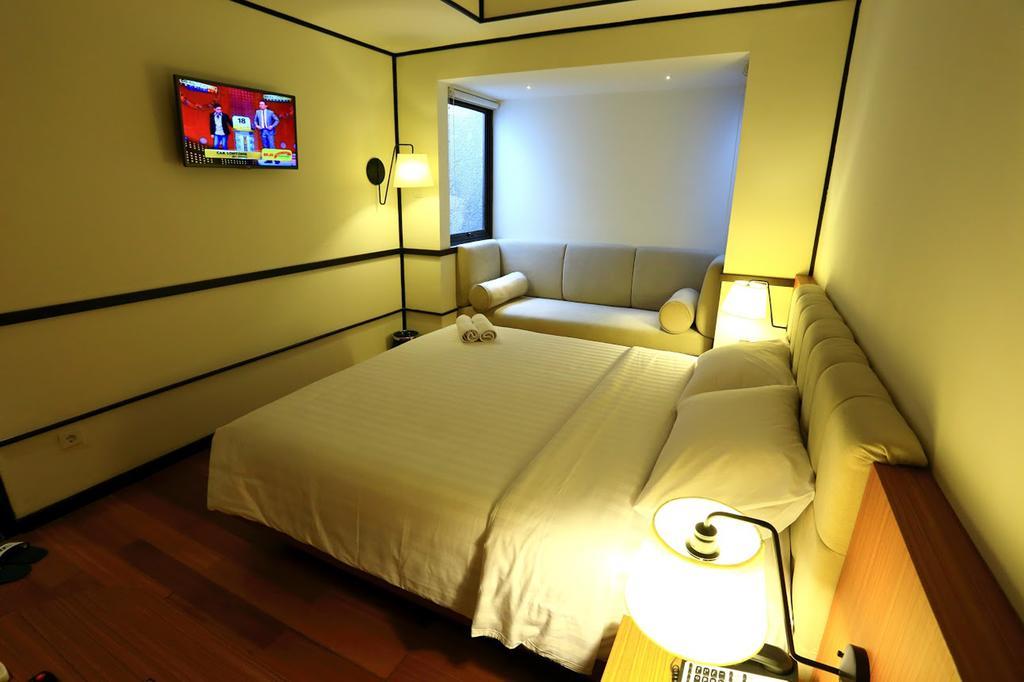 Namin Dago Hotel Бандунг Номер фото
